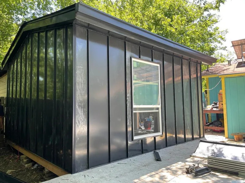 Black standing seam metal wall panels for Roof Inspection in Jefferson City